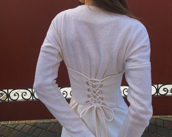 Simple long knitted wedding dress made from natural wool White woolen bouclé dress with long sleeves and an imitation corset on the back.