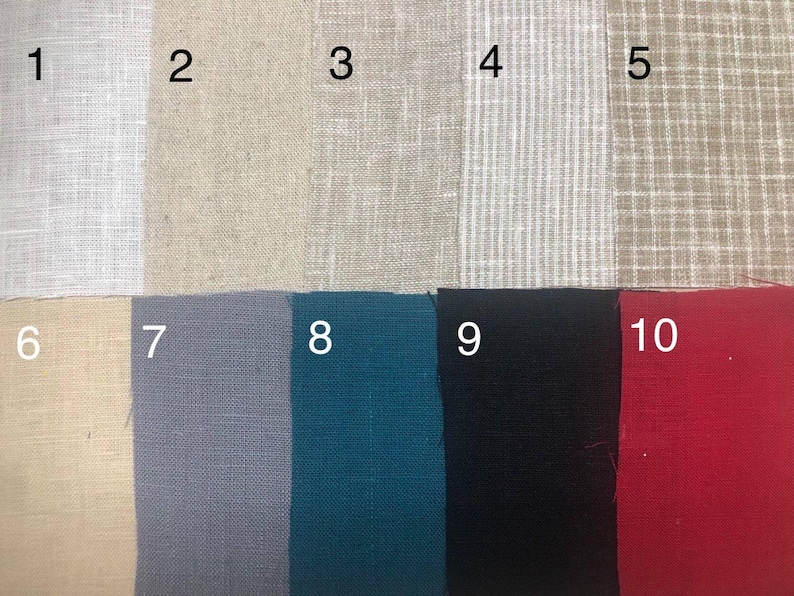 May include: A fabric swatch card featuring ten different linen fabric samples. The colors include white, beige, tan, light gray with white stripes, tan with white grid, light yellow, gray-blue, teal, black, and red.