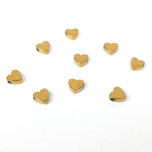 Herz Spacer 6x5,5mm synthetisches Hämatit goldfarben 10 Stück