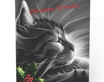 Puede incluir: Una ilustración en blanco y negro de un gato durmiendo con los ojos cerrados. El gato está rodeado de un brillo blanco y tiene una rama de acebo con bayas rojas en la parte inferior de la imagen. El texto "Christmas Dreams..." está escrito en rojo en la parte superior de la imagen.