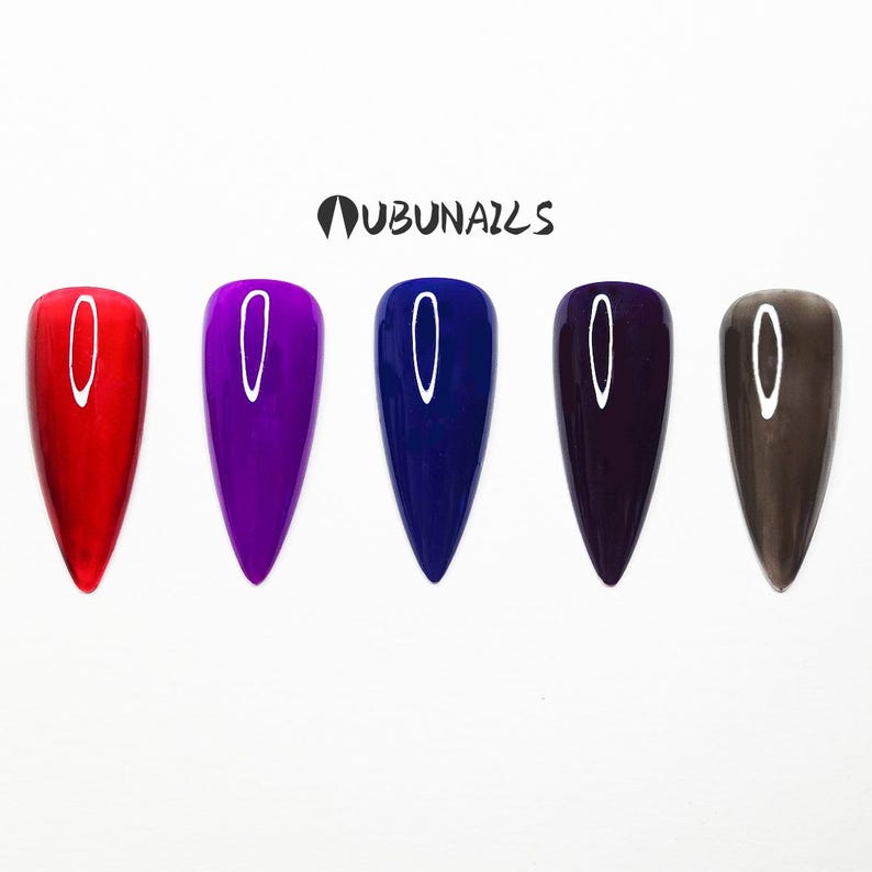 Handmade press-on nails in neon red, navy, purple, and chrome, featuring a mix of short and long shapes. Styles include minimalist city-girl daily wear, clean glossy finishes, and bold birthday party looks. Custom Freestyle grey nails, vibrant neon pure colors, and personalized faux acrylics. Each set is uniquely designed by wubunails for chic OOTD vibes. Perfect for gifting, events, or effortless beauty on the go. Includes glue-on options for every taste, from simple to dramatic.