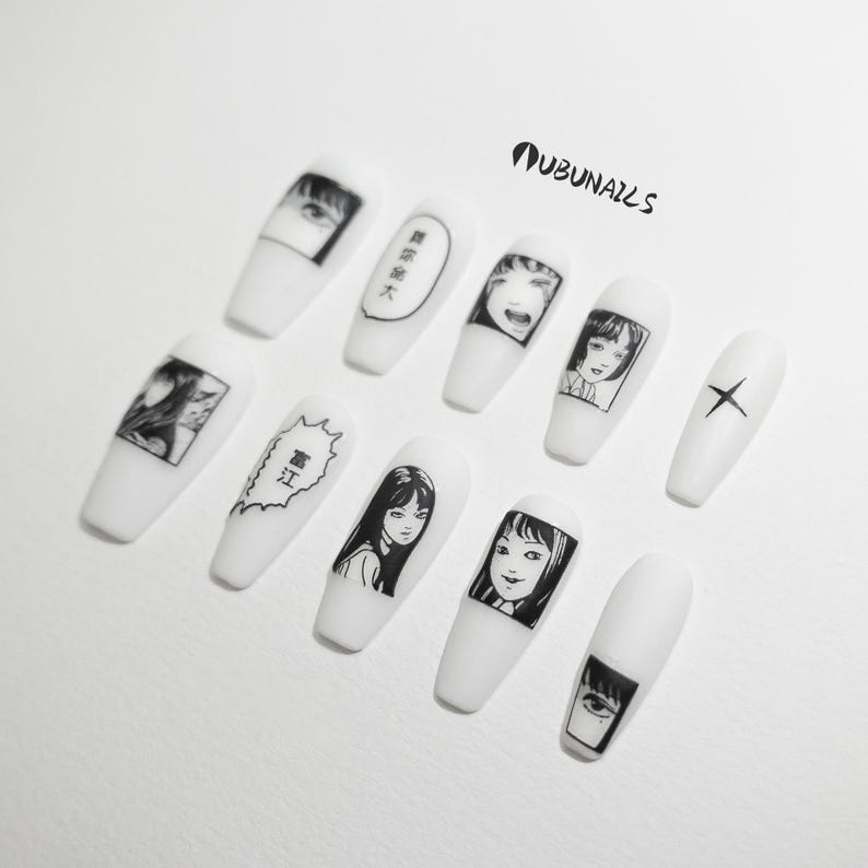handmade matte press-on nails with a gothic Halloween theme. Each nail features black and white manga illustrations inspired by Junji Ito's Tomie, printed in comic panel style. Nails are sharp coffin shape, with high contrast matte finish and eerie graphic details. Ideal for cosplay, horror-themed birthday party, Halloween costumes or comic conventions. Customizable design by wubunails for gothic lovers. A perfect glue-on faux acrylic nail set for fans of Japanese horror and manga.
