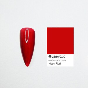 Handmade press-on nails in neon red, navy, purple, and chrome, featuring a mix of short and long shapes. Styles include minimalist city-girl daily wear, clean glossy finishes, and bold birthday party looks. Custom Freestyle grey nails, vibrant neon pure colors, and personalized faux acrylics. Each set is uniquely designed by wubunails for chic OOTD vibes. Perfect for gifting, events, or effortless beauty on the go. Includes glue-on options for every taste, from simple to dramatic.