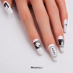 handmade matte press-on nails with a gothic Halloween theme. Each nail features black and white manga illustrations inspired by Junji Ito's Tomie, printed in comic panel style. Nails are sharp coffin shape, with high contrast matte finish and eerie graphic details. Ideal for cosplay, horror-themed birthday party, Halloween costumes or comic conventions. Customizable design by wubunails for gothic lovers. A perfect glue-on faux acrylic nail set for fans of Japanese horror and manga.