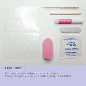 May include: A set of fake nails with a free tools kit, including two cuticle removal sticks, two nail files, two sheets of gel glue, and one alcohol prep pad. The kit also includes a nail glue bottle and a nail file.