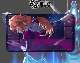 May include: A rectangular Gundam card game playmat featuring a character in a purple and white suit against a starry background. The mat has labeled zones for Base, Shields, Resource Deck, Deck, Trash, and Resource Area. The Gundam Card Game logo is at the top.