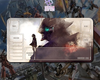 May include: A rectangular Gundam card game playmat featuring a detailed illustration of mecha and a figure. The playmat has designated areas for cards, including "Base," "Shields," and "Resource Deck." The Gundam Card Game logo is visible.