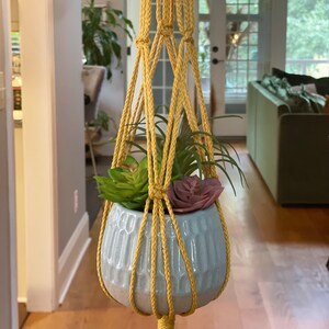 Handmade macrame plant hangers, equine inspired macrame plant hangers, macrame baby shower gifts, custom options available.