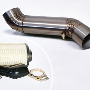 May include: A silver metal exhaust pipe with a black air filter, a black rubber hose, and two silver metal clamps.