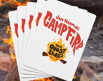 May include: A stack of white playing cards with the text "Jim Harold's Campfire True Ghost Stories" in red and orange. The cards are fanned out in front of a campfire with flames.