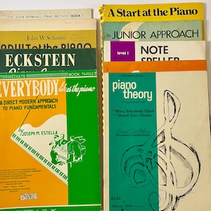 May include: A collection of piano instruction books, including "A Start at the Piano", "The Junior Approach", "Note Speller", "Piano Theory", "Everybody Likes the Piano", and "Eckstein Circle".