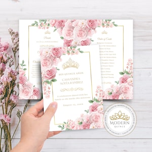 May include: A set of elegant quinceañera invitations with a floral design. The invitations feature pink roses, gold accents, and the text "Mis Quince Años" with the name Cassandra Sofia Ramirez. The design includes a gold crown.