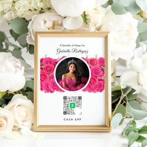 Può includere: Una cornice dorata con sfondo bianco e un design floreale rosa. Il testo "A Sprinkle of Magic for Gabriella Rodriguez" è in alto. Una foto di una giovane donna in un abito rosa è al centro. Un codice QR con il testo "CASH APP" è in basso.