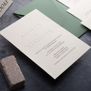 Embossed wedding invitations, letterpress design, minimalist style, custom card, and sage green envelope