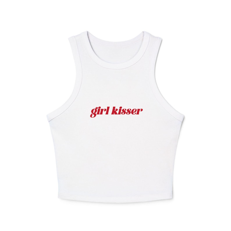 May include: White crop top with a scoop neck and the red text "girl kisser" printed across the front. The top is sleeveless and made of a soft, likely cotton material.