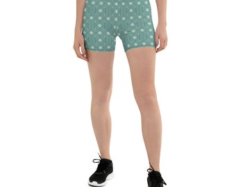 May include: A pair of athletic shorts with a teal and cream geometric pattern. The shorts are made of a stretchy, comfortable fabric and are perfect for working out or running errands.
