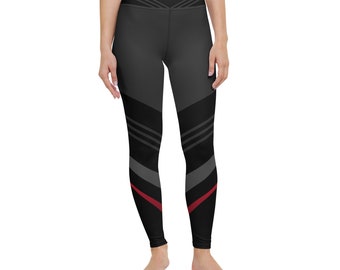 May include: Black high-waisted leggings with a geometric pattern in shades of gray and a red stripe down the side.