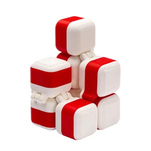 May include: A white and red cube puzzle with interlocking pieces. The puzzle is made of plastic and has a smooth, glossy finish.