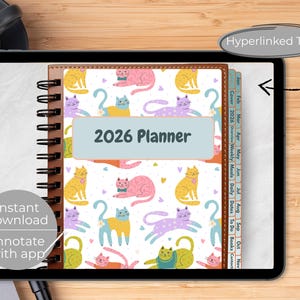 May include: A digital 2026 planner with a spiral binding, featuring a colorful cat pattern. The planner includes tabs for each month and the text "2026 Planner". The image also includes the text "Instant download" and "Annotate with app".