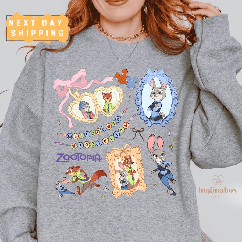 A gray sweatshirt with various cartoon animal characters and a "Zootopia" logo printed on it.