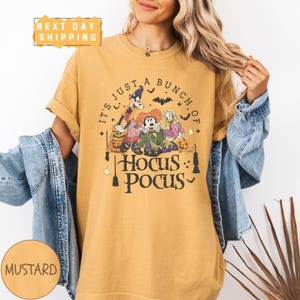 a woman wearing a t - shirt that says it's just a bunch of
