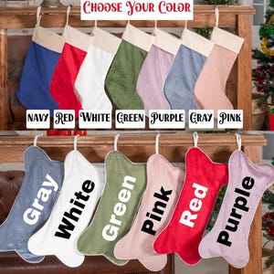 a display of christmas stockings that say choose your color