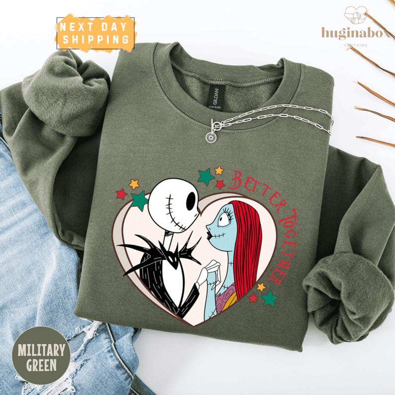 A military green sweatshirt with a graphic of Jack Skellington and Sally from the movie "The Nightmare Before Christmas" and the text "BETTER TOGETHER" printed on it.