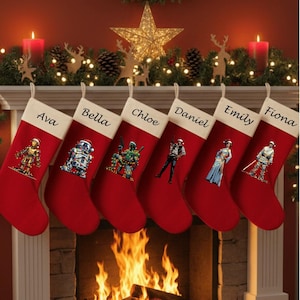 May include: Six red Christmas stockings with white cuffs hang above a fireplace. Each stocking is personalized with a name and a Star Wars character graphic. Festive holiday decor includes candles, lights, and a star.