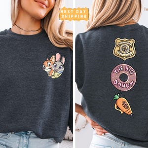 The image is a collage of two photos of a woman wearing a gray sweatshirt with various cartoon characters and logos on the back.