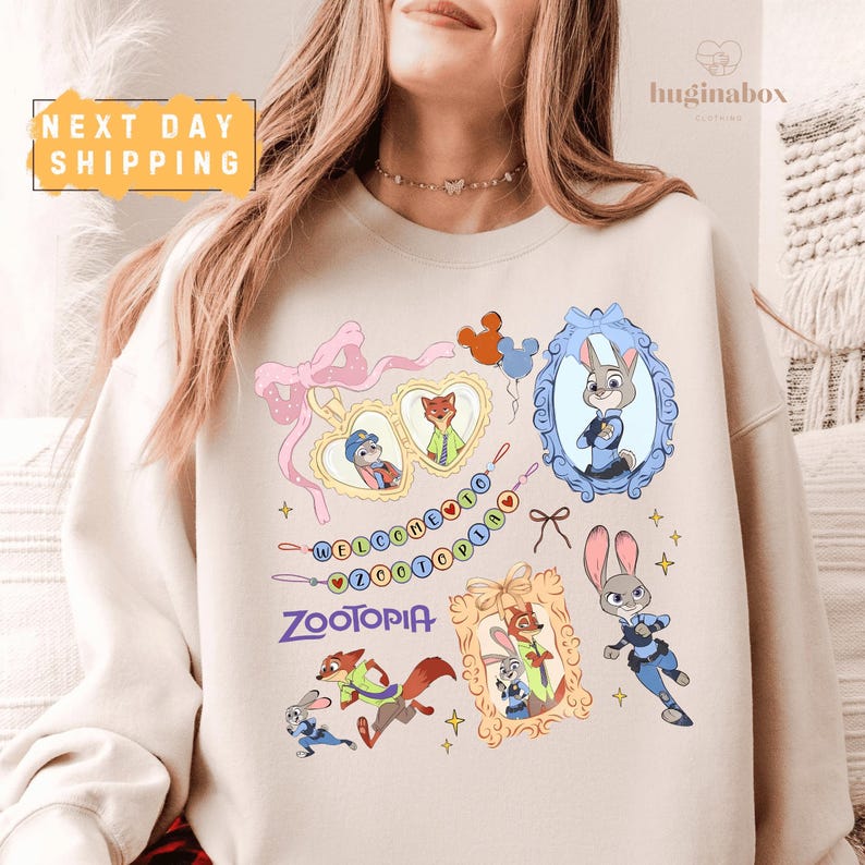 A woman wearing a white sweatshirt with various cartoon animal characters and a heart-shaped frame.