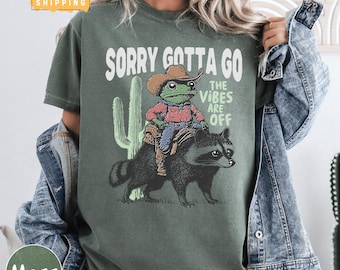 Sorry Gotta Go The Vibes Are Off Comfort Colors Shirt, Cowboy Frog and Raccoon Tee, Funny Western Trash Panda Meme Shirt