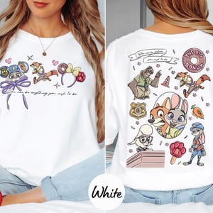 The image is a collage of two pictures, one showing the front and the other the back of a white t-shirt with a cartoon character design.