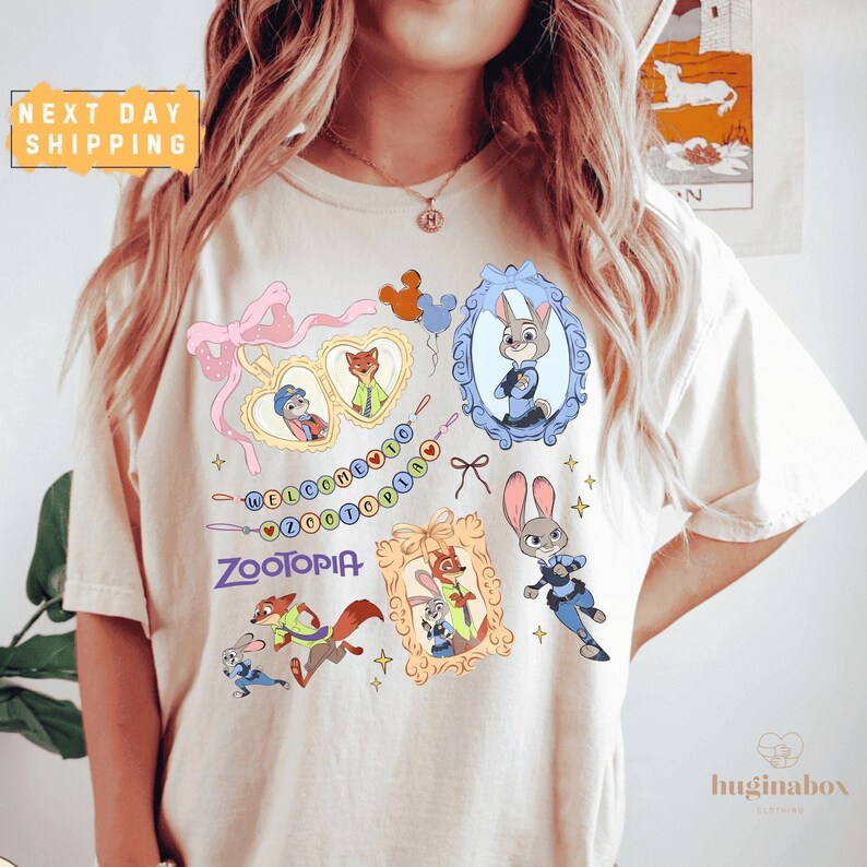 A person wearing a white t-shirt with various cartoon characters and designs printed on it.
