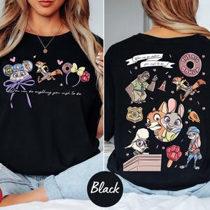 The image is a collage of two photos featuring a woman wearing a black t-shirt with a cartoon character design. The woman is posing with the t-shirt, which has a colorful and playful design featuring various cartoon characters and elements.