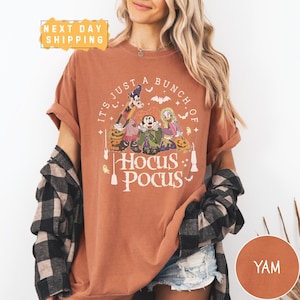 a woman wearing a t - shirt that says it's just a bunch of