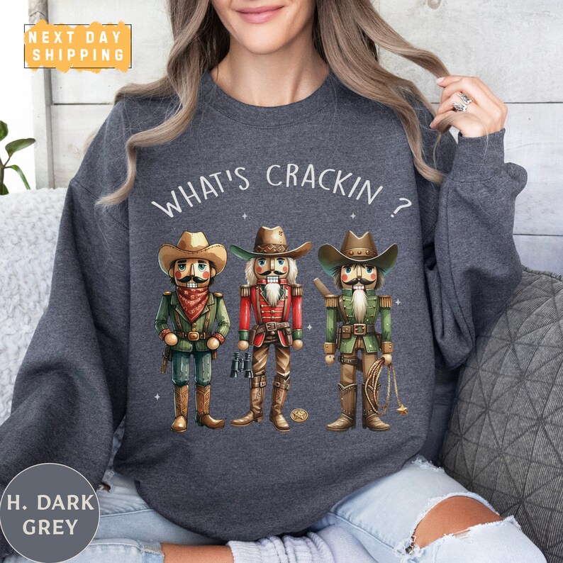a woman wearing a sweatshirt that says what's crackin?