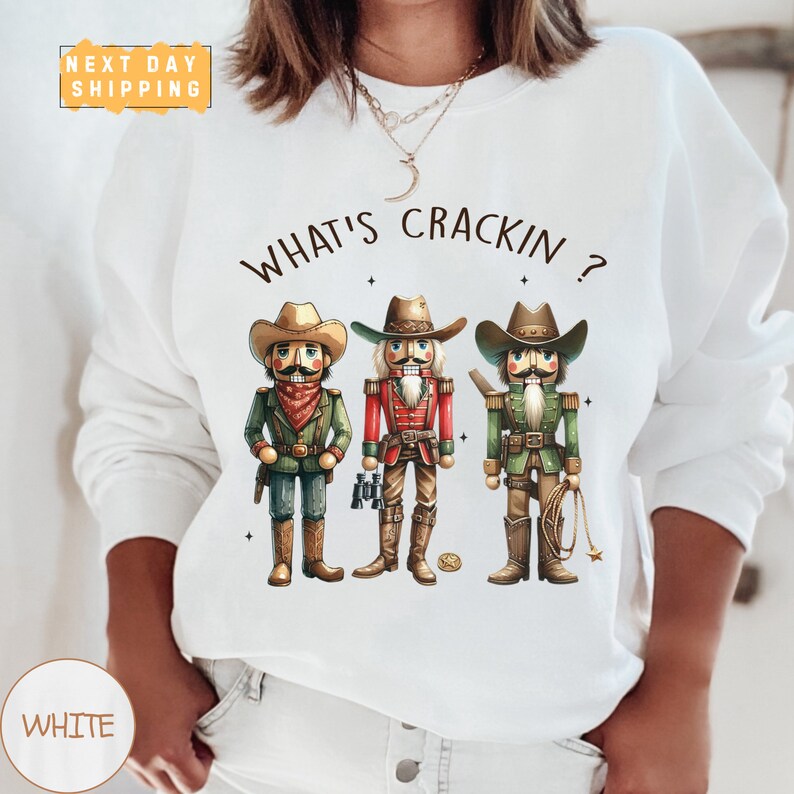 a woman wearing a white shirt with three cartoon characters on it