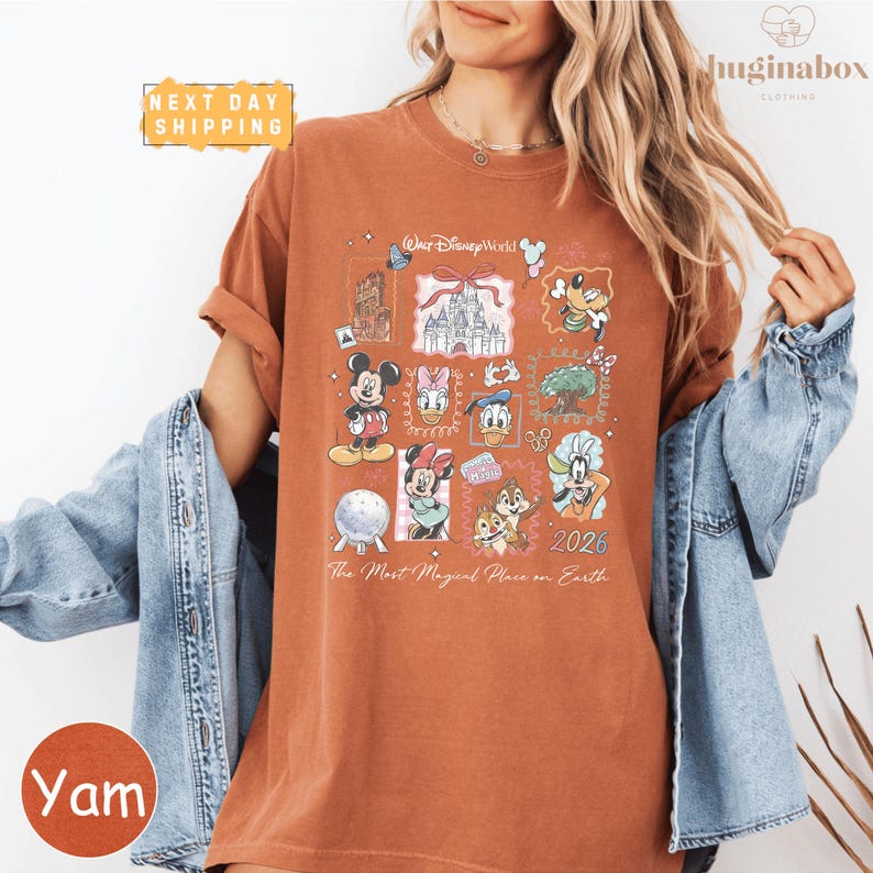 A woman wearing a t-shirt with Disney characters and text, along with a denim jacket, posing for a photo.