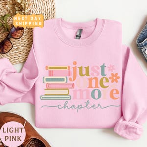 a pink shirt with the words just one more on it