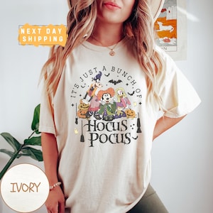 a woman wearing a t - shirt that says it's just a bunch of