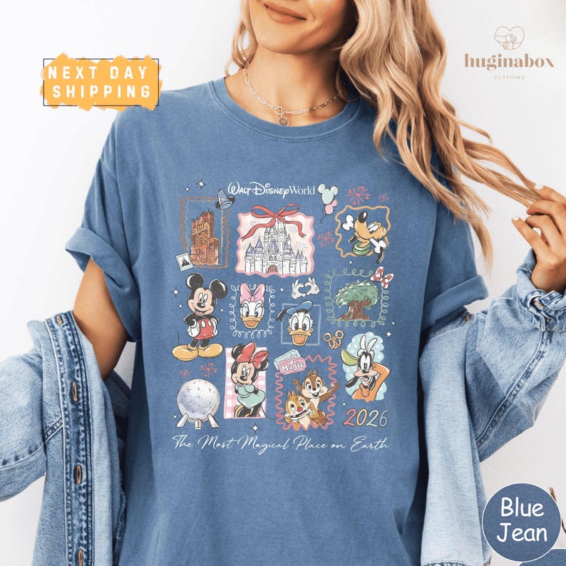 A woman wearing a blue t-shirt with a collage of Disney characters and a text overlay that says "The Most Magical Place on Earth" and "Next Day Shipping".