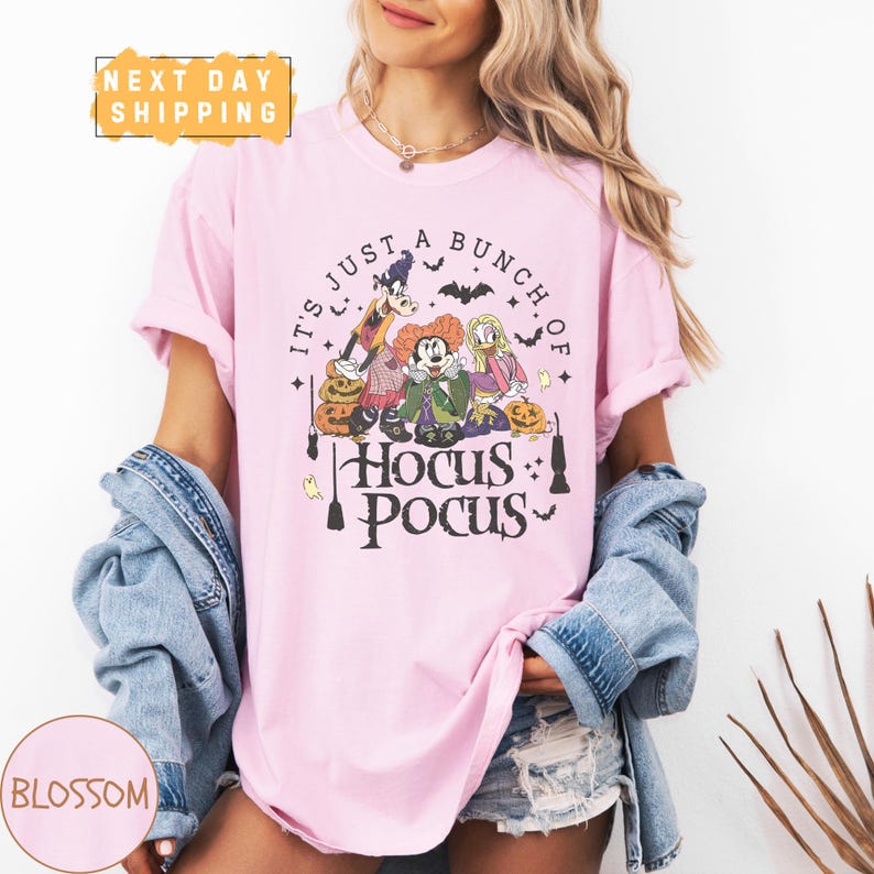 a woman wearing a pink shirt that says it's just a bunch of hoc