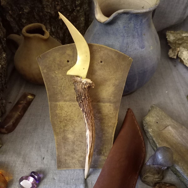 Bronze herbal sickle (boline) with deer antler handle. Leather scabbard