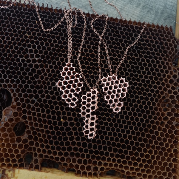 Save the bees. These necklaces and pendants are made from natural honeycomb plated with copper.