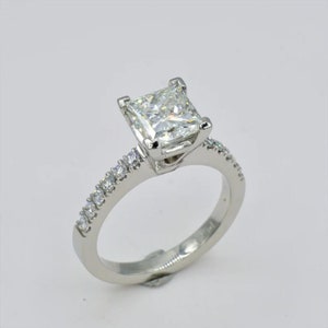 Platinum Princess Cut Diamond Engagement Ring, 1.54ct GIA Certified, G Color, SI1 Clarity, With 12 Side Round Brilliant Diamonds of .24cttw