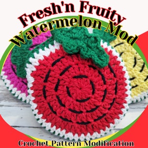 May include: Crochet pattern modification for a watermelon-shaped crochet project. The project is red with black seeds and a green leaf on top. The text "Fresh'n Fruity Watermelon Mod" is displayed above the project.