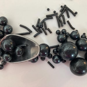 Black Sprinkles and Assorted Sized Green Sugar Pearls