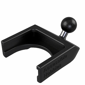 May include: Black plastic phone mount with a ball joint and the text "Accessible Hobbies" on the side.