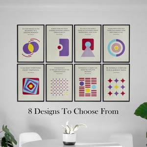 May include: Eight framed art prints with minimalist designs and quotes in black frames. The prints feature geometric shapes in purple, red, yellow, and blue. The text "8 Designs To Choose From" is at the bottom.
