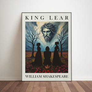 May include: A framed art print of King Lear by William Shakespeare. The artwork features a portrait of King Lear above three silhouetted figures, a crown, and a field of pink flowers. The title and author's name are printed in black.